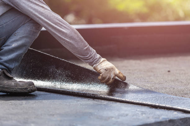 Professional Waterproofing technician working in Beaverton, MI